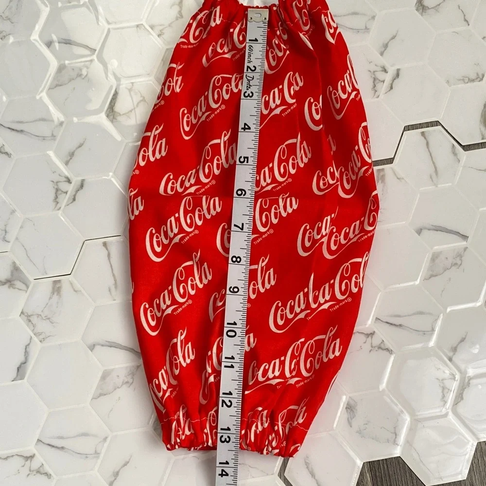 Handmade wall hanging grocery bags organizer and pantry with Coca Cola logo.
